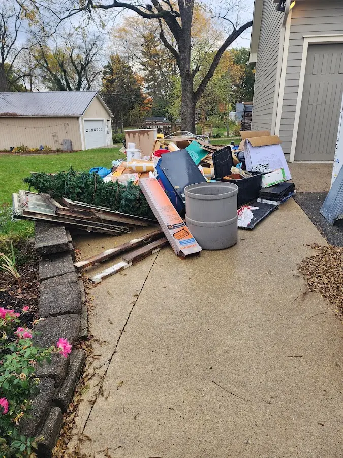 Dumpster being loaded with debris for Commercial Dumpster Rental in Brook Park